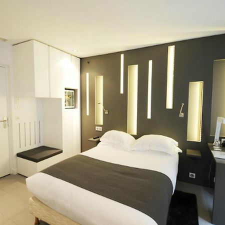 Hotel Arc De Triomphe Etoile París Habitación foto